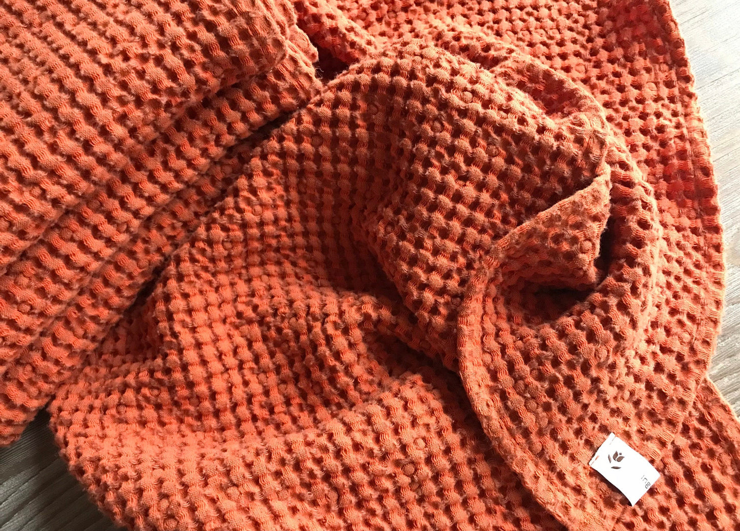 Linen waffle weave fingertip towel. Burnt Orange