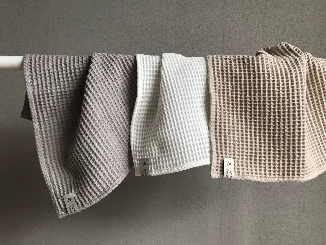 Cotton fingertip waffle weave towel. Assorted beige colors