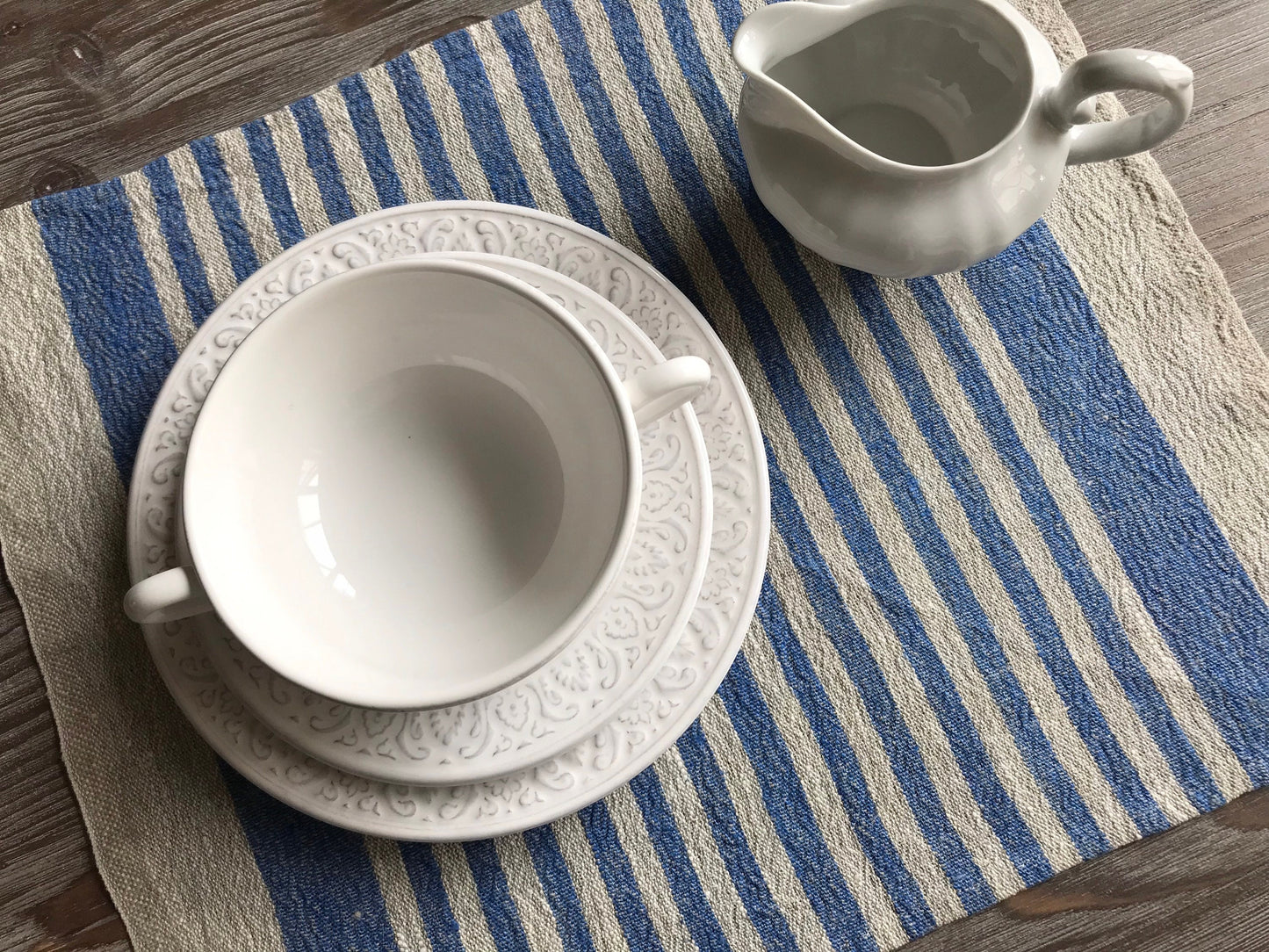 Linen place mat with blue stripes