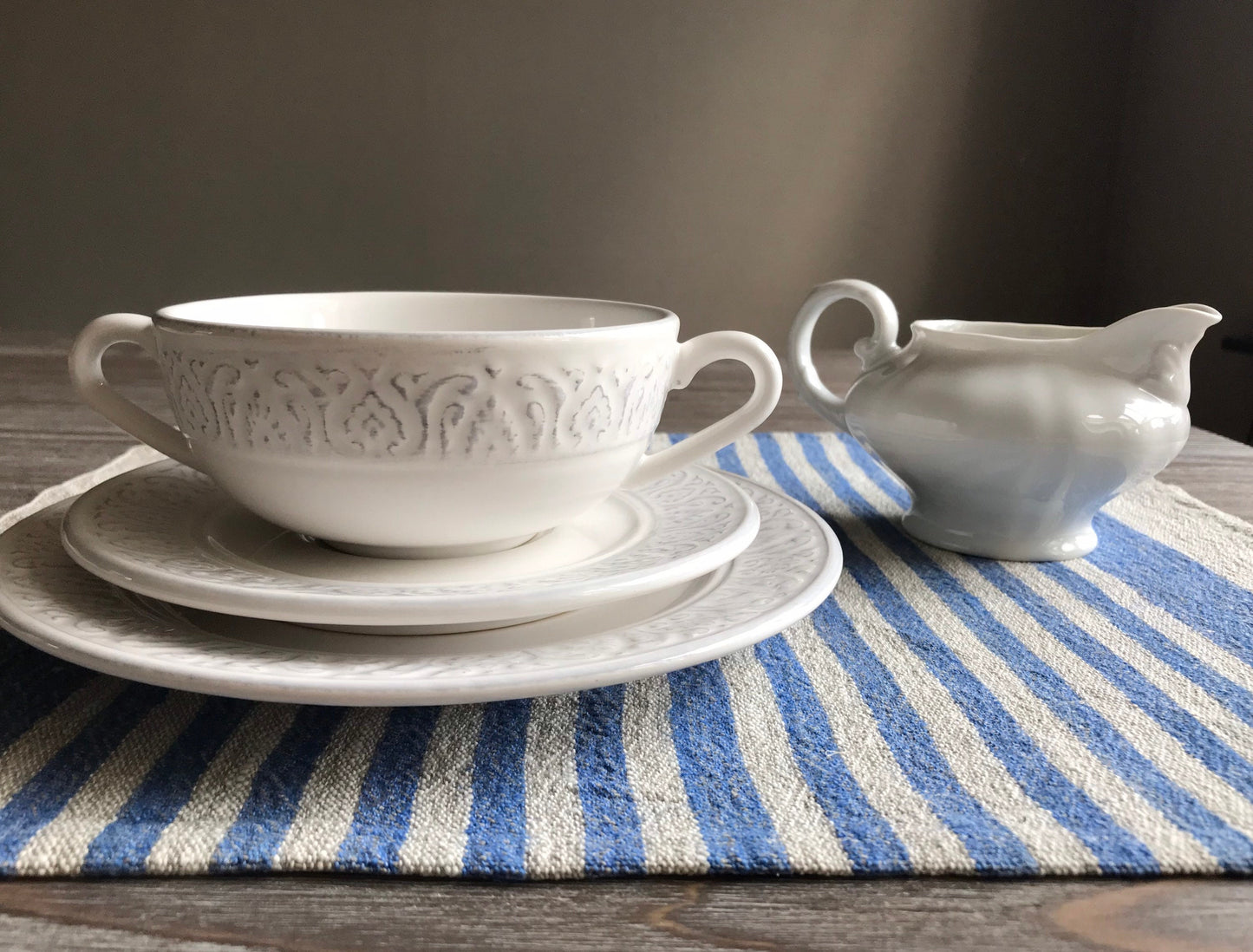 Linen place mat with blue stripes